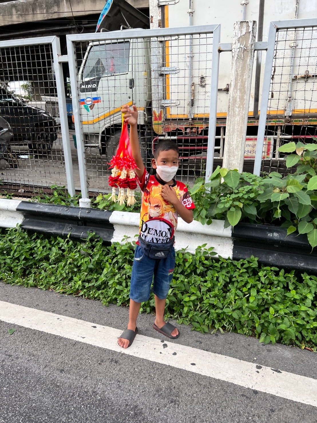 Volunteer help turning flowers into beautiful garlands